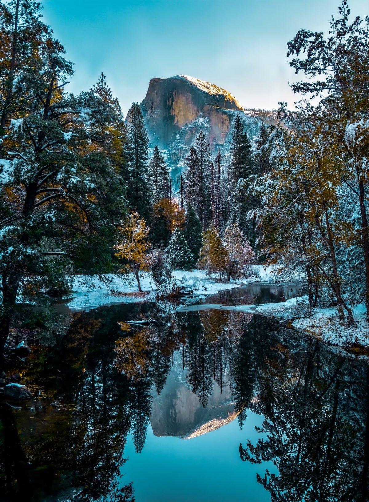 Half Dome after fresh snow, reflected in the still Merced River
